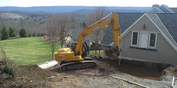 A Pictute of Bob Marki excavating for an addition in Monroe County