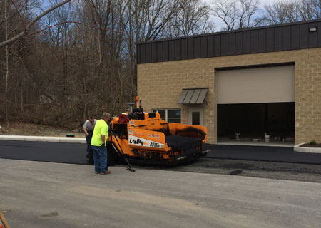 Bob Marki and crew paving the parking lot at Stoud Industrial Park